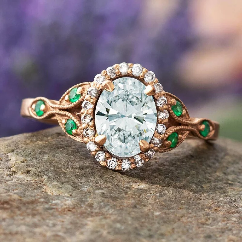 Oval Halo Engagement Ring With Emerald Accent Stones